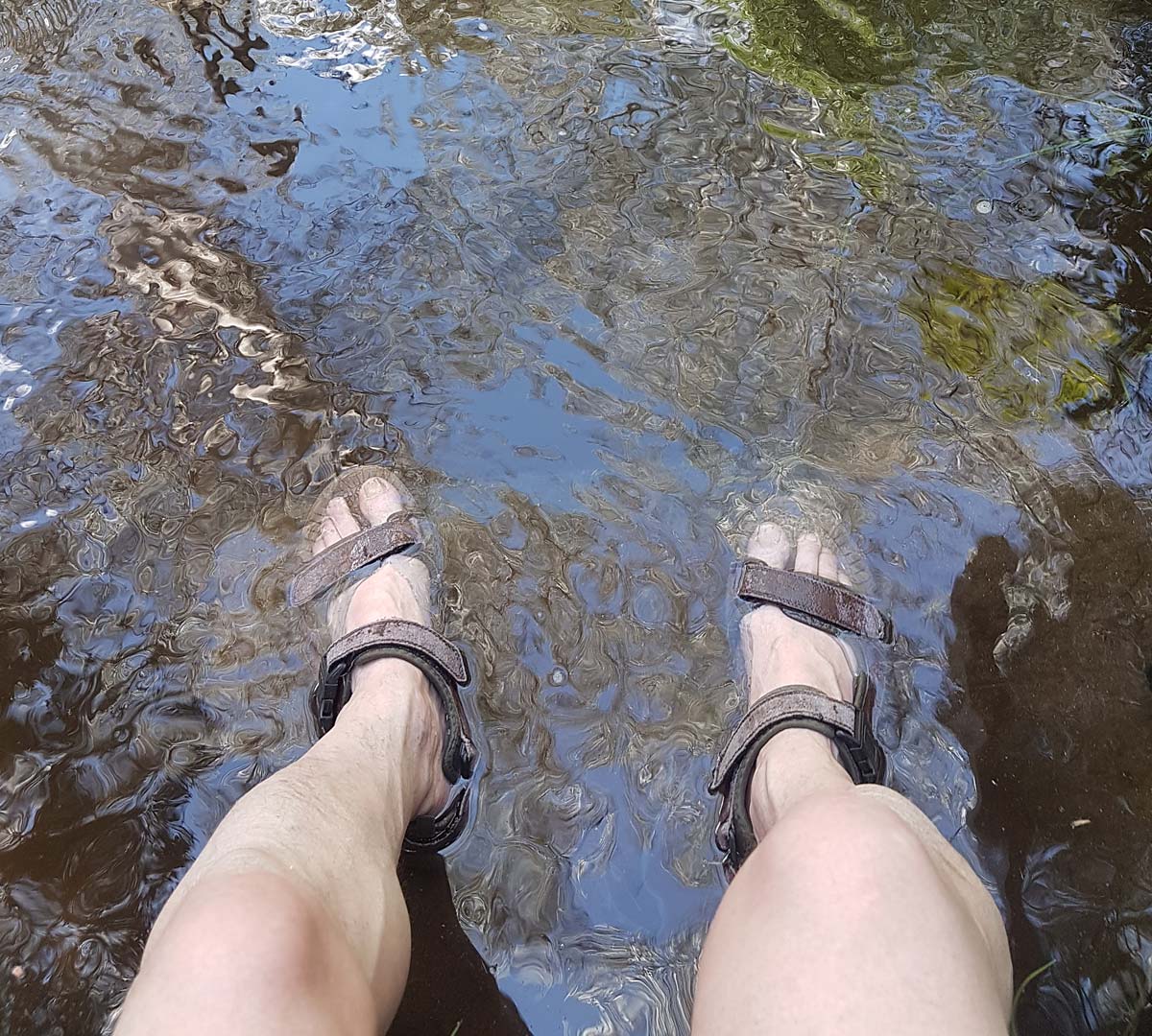 Cooling your feet in the river on a very hot day.